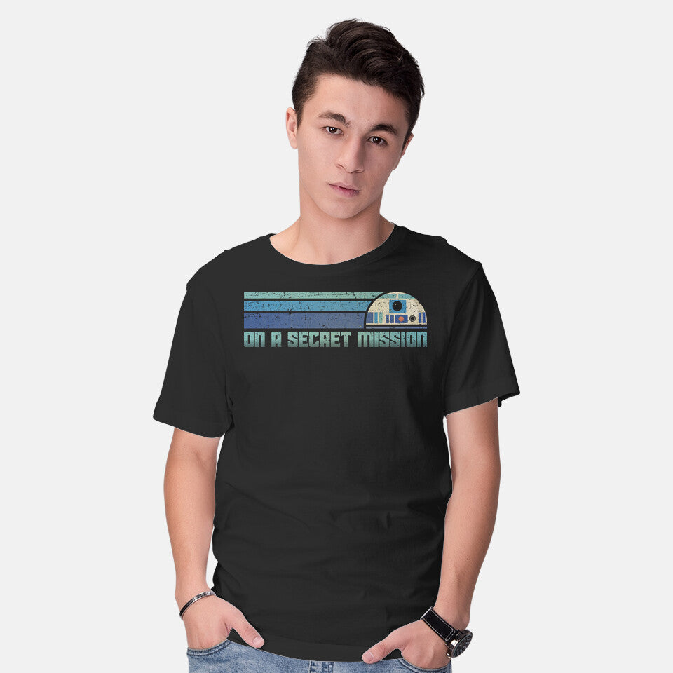 Model wearing black On A Secret Mission – Sci-Fi Graphic T-Shirt