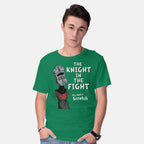 Model wearing green The Knight In The Fight – Movie Graphic T-Shirt