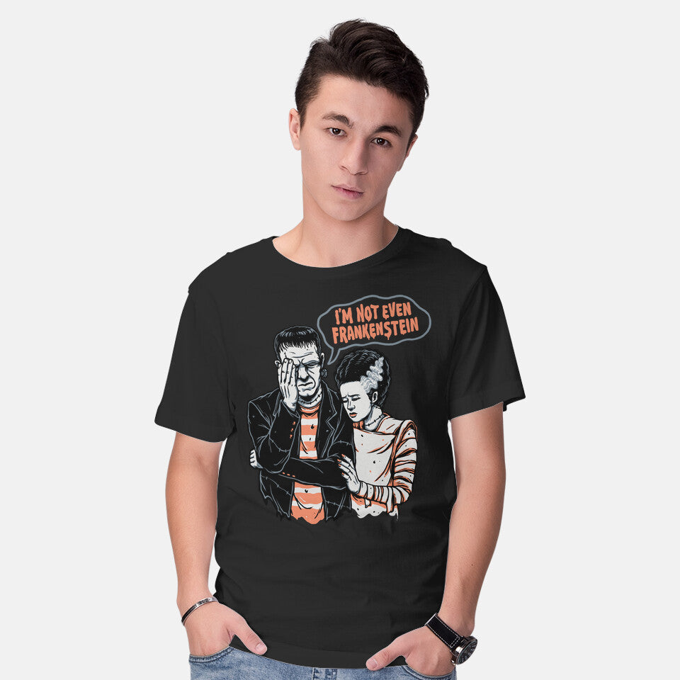 Model wearing black I'm Not Even Frankenstein – Horror Graphic T-Shirt