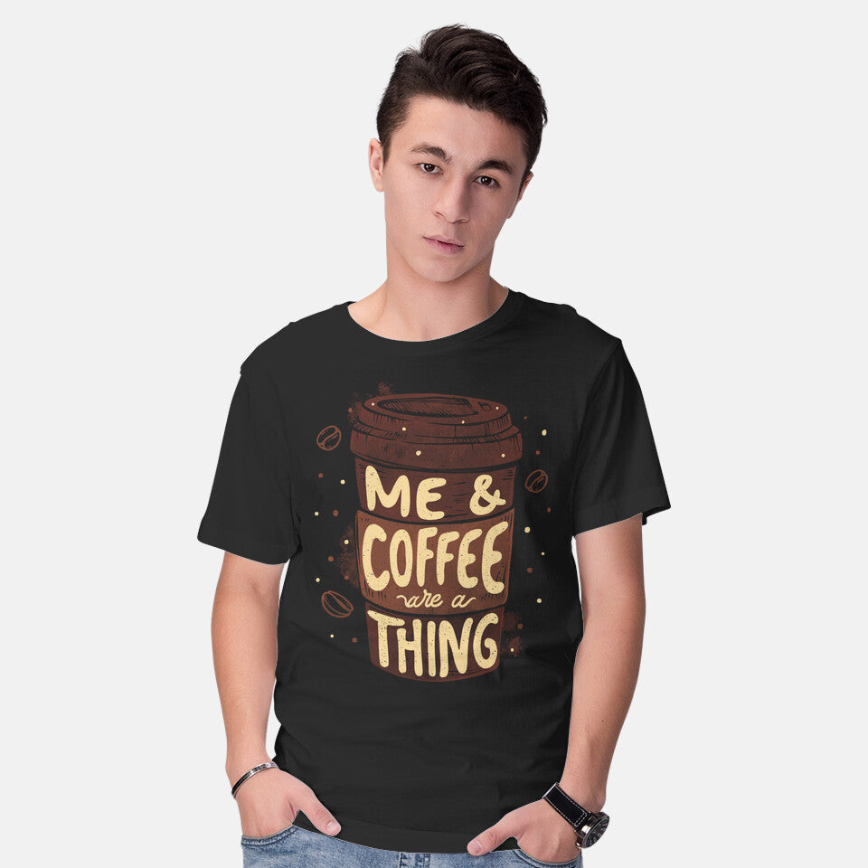 Model wearing black Me And Coffee Are A Thing – Coffee Graphic T-Shirt