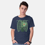 Model wearing navy Grinch's Heart – Movie Graphic T-Shirt