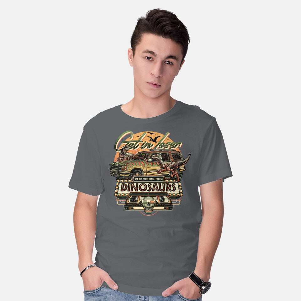 Model wearing charcoal Running From Dinosaurs – Movie Graphic T-Shirt
